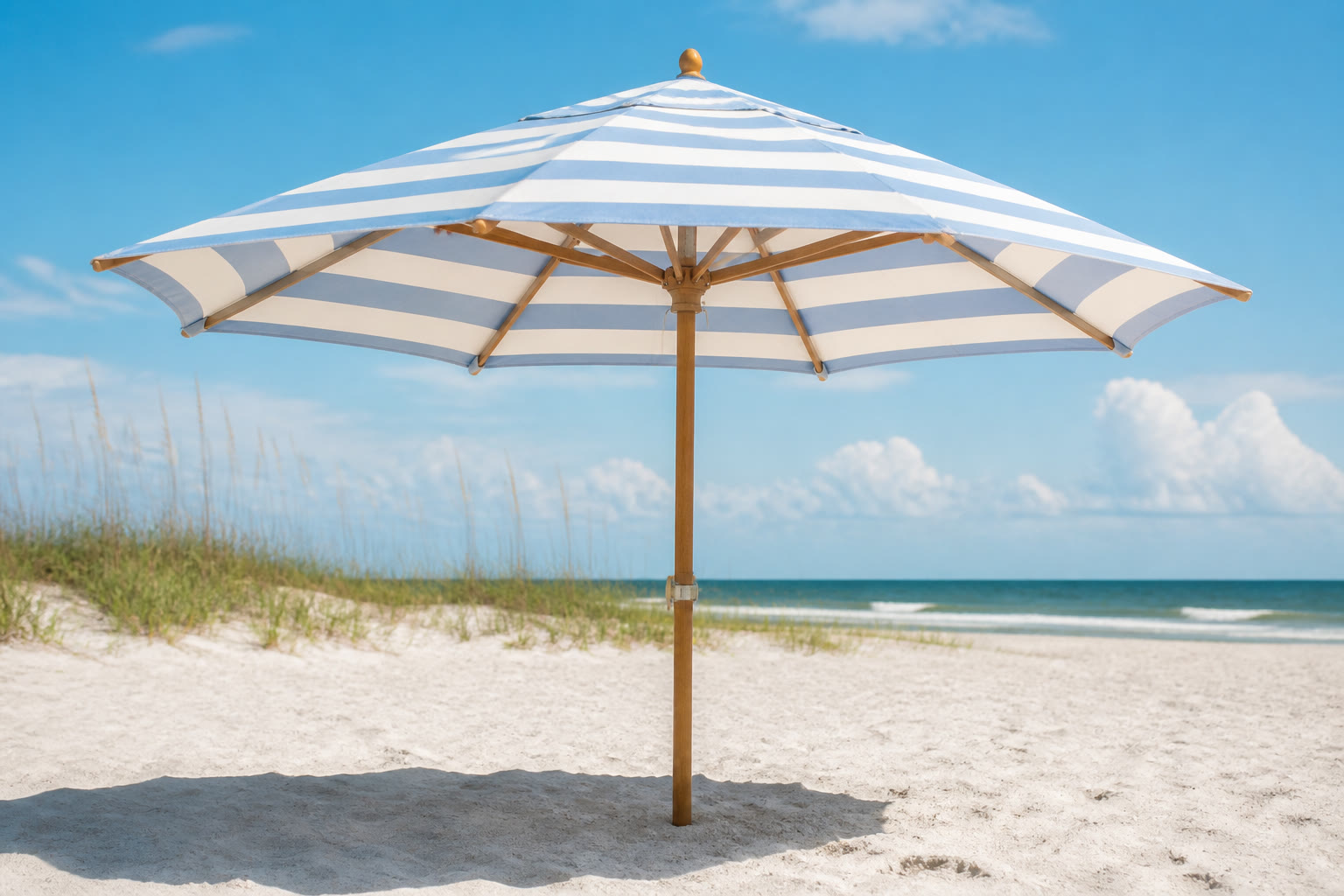 Beach umbrella on sandy shore